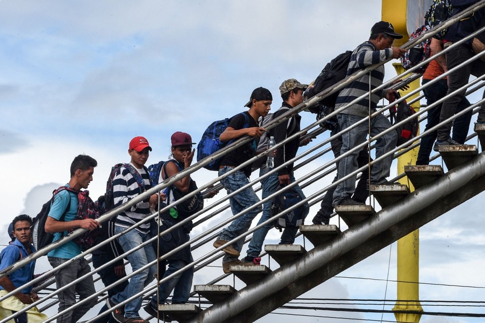 Migranten uit Honduras op weg naar de grens tussen Guatemala en Mexico. 